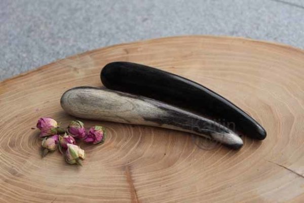 massagestaaf versteend hout